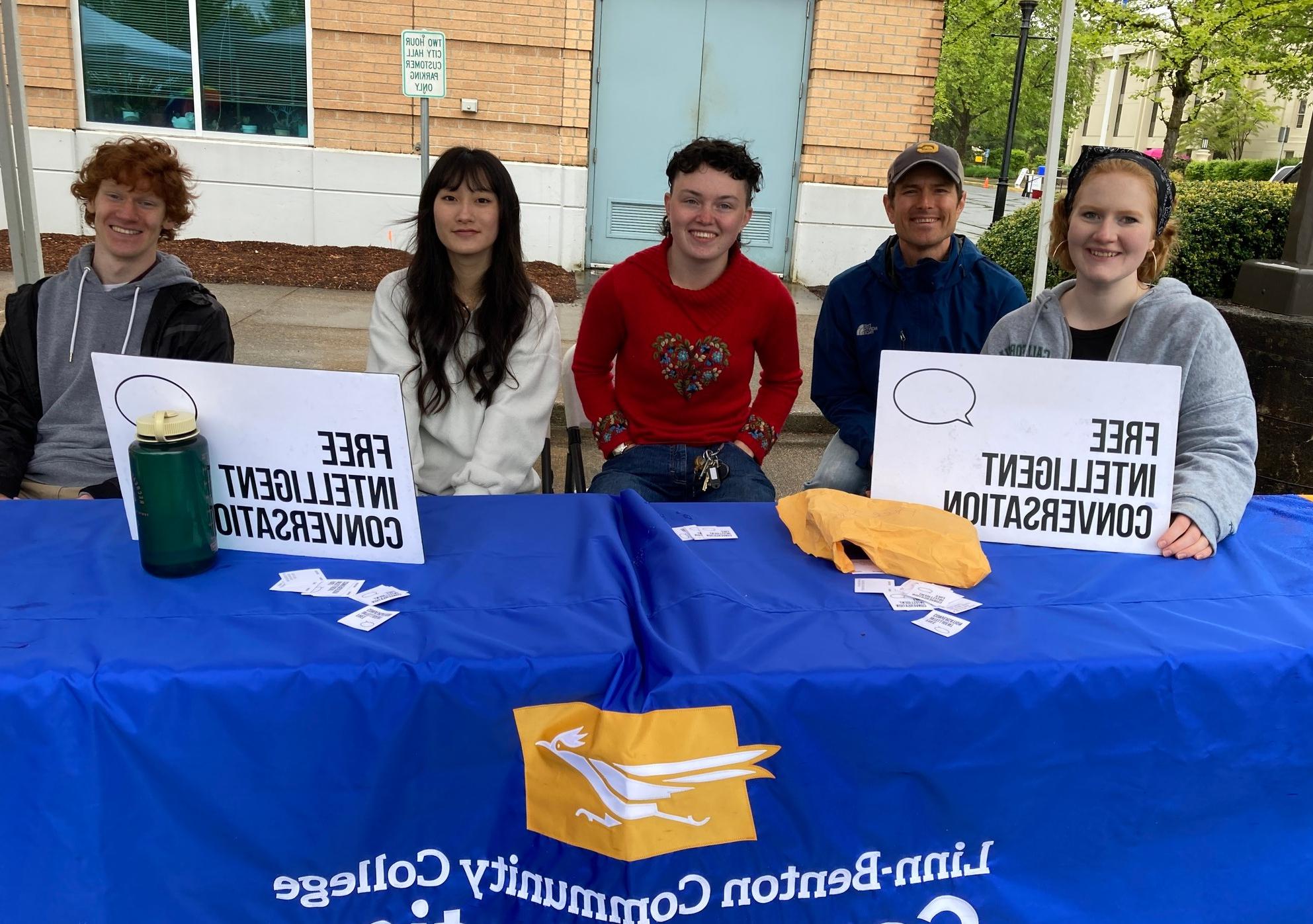 Photo of Civil Discourse Program members running a table